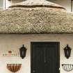 Detail of thatching over doorway; Rose Cottage, Town Yetholm.