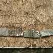 Detail of roof showing netting and stone weights; Southvoe croft house museum, Shetland.