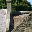View of chimney stack and ridge, damaged thatch, and adjoining roofs; Soutar Johnnie's cottage, Kirkoswald.