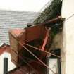 Detail of damaged thatched roof showing netting and timber boxing; Bachelors club, Tarbolton.