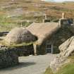 View of thatched Hebridean Style cottage and outbuildings;  Garenin Township, Lewis.