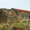 View of 18th century Byre with part damaged thatch roof, part corrugated iron; Ruisgarry, Baile.
