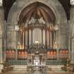 General view of chancel with organ, communion table, pulpit and lecturn.