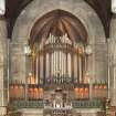 General view of chancel with organ, communion table, pulpit and lecturn.