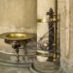Detail of wall sconce and collection plate.