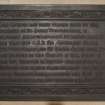 Detail of building memorial plaque in entrance lobby.