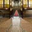 Detail of floor in entrance lobby looking down aisle to chancel.