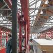 General view of metal pillars, roof trusses and beams in the central hall.