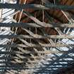 Detail of roof trusses and beams in the central hall.