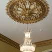 Ground floor. Dining room. Detail of ceiling rose and chandelier.