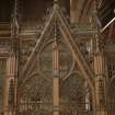 East transept. Screen at south end, tracery.