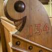 Detail of end of pew.