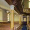 General view of aisle looking towards main entrance.