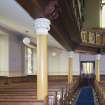 General view of aisle looking towards main entrance.
