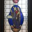 Detail of stained glass window in door to session house.