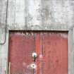 Metal door at north end of Wall C, direction facing W