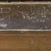 Composite image of pew showing graffiti.