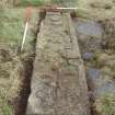 Archaeological works, Stone 7 with slot excavated around circumference prior to lifting, St Columba's Chapel, Aiginis, Isle of Lewis