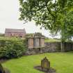 View of graveyard looking towards former tithe barn. 