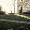 Watching Brief photograph, courtyard prior to removal of cobbles, looking NW, Barra Castle