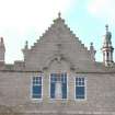Survey photograph of New College, E gable of N wing showing Upper Library window, Blairs College and Estate 