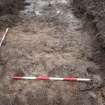 Evaluation photograph, Stone spread (natural) taken from E (Trench 16), Knockroom Farm, Cumnock, East Ayrshire