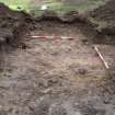 Evaluation photograph, Stone spread (natural) taken from W (Trench 16), Knockroom Farm, Cumnock, East Ayrshire