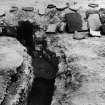 Excavation photograph: the residence flue no. 3, with step and division, looking N. The tiles were found in the ruins.