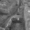 Excavation photograph from Fendoch Roman Fort showing barrack 1 veranda, looking east.
