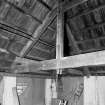 Interior-detail of hip-truss in airing loft