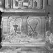 Interior-detail of carving at base of monument in crypt