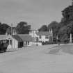 Bridgend, Islay.
General view from South towards bridge, including post office and parked car.
Insc:'893/31'
