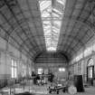 Edinburgh, Granton Gasworks, Meter House, interior
View from E showing pavilion roof structure and unmaintained clerestory glazing (building dis-used on date of survey). Two Connersville Meters by WC Holmes and Co. of Huddersfield (1949) are visible in middle background