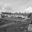 Isle of Whithorn, Harbour
View from S showing church, slipway and boatbuilding shed