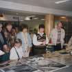 Commission at Work.
Lesley Ferguson showing visitors examples from the collections in the NMRS library.