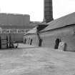 Armadale, Etna Brickworks
View from N showing ENE front of W Hoffman kiln and main buildings in background. Both 10 chamber kilns were demolished in 1984.