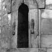 Historic photographic view of doorway in round tower.
