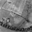 Waulkmill, oblique aerial view, taken from the ENE, centred on the cropmarks of a fort.