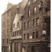 Postcard view of St John's Street, 184-186 Canongate, St John's Close and 190 Canongate.