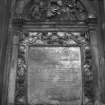 Detail of monument to Elizabeth Paton dated 1676 with robed skeleton in tympanum at top.