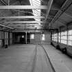 Huntingtowerfield, Bleach and Dye Works, Interior
View looking W showing storage area (first floor above wet finishing department) with bale presses on left