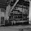 Huntingtowerfield, Bleach and Dye Works, Interior
View looking SE showing belt stretcher 108'' goods which is made by Archibald Edmeston and son limited, Partricroft, Manchester (up to 108'' from 24'')