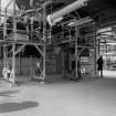 Huntingtowerfield, Bleach and Dye Works, Interior
View looking SE showing 2 'Foxwell' double doubling machines 90'' goods in lapping department