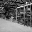 Huntingtowerfield, Bleach and Dye Works, Interior
View looking SE showing Dalglish clip stenter 35' x 90'' goods with 15 cylinder horizontal drying machine 110'' face in background