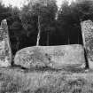 View of recumbent stone and pillars from the south, with two markings on the recumbent stone.
Original negative captioned 'Cothiemuir Stone Circle, Keig. Recumbent Stone showing "Devil's Hoofprints" 1910'.
