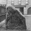 View of Pictish symbol stone bearing arch symbol.
Original negative captioned: 'Sculptured Stone in "The Square", Huntly April 1905'.
