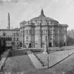 General view of McEwan Hall looking over Bristo Square with ornamental lamp in centre
