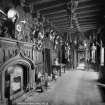 Interior-general view of Entrance Hall showing armoury and fireplace. Digital image of B/66457.
