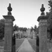 View from South through ornamental gates of garden front