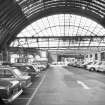 Interior
View looking WNW showing cars parked under S arched roof